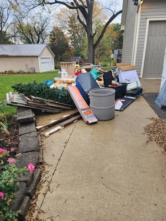 Dumpster being loaded with debris for 3 Yard Dumpster Rental in Baxley
